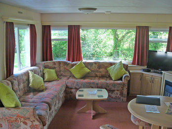 Comfortable spacious lounge in luxury holiday caravan