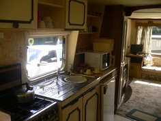 Well equipped galley kitchen in standard holiday caravan